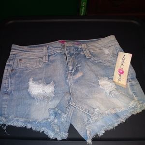 Distressed light blue jean shorts. NWT